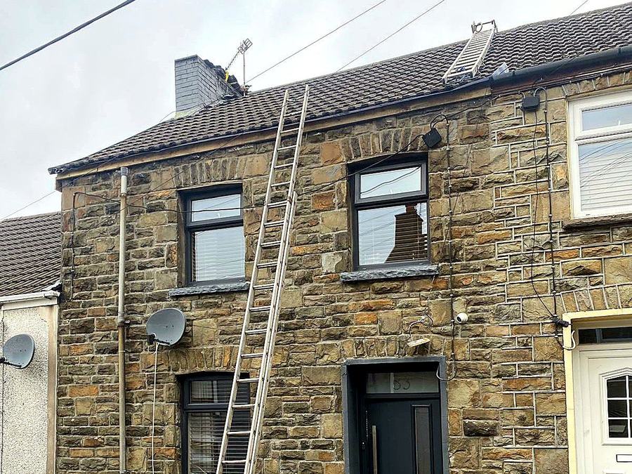 Roofing work on a stone terrace house